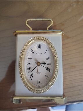 Bulova White and Gold Oval-Faced Mantel Clock